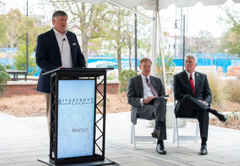 Pace Halter, W.C. Bradley Real Estate President & COO, announcing details of the final phases of Riverfront Place alongside Kevin Blair, President & COO of Synovus, and City of Columbus Mayor Skip Henderson.